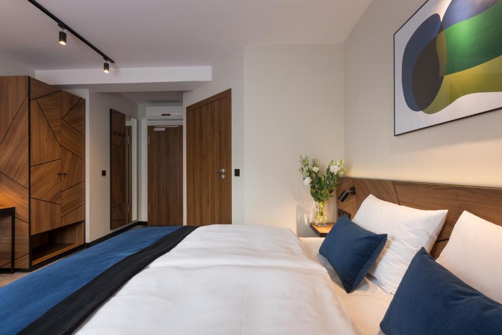 Posteľ alebo postele v izbe v ubytovaní Ascot Premium Hotel