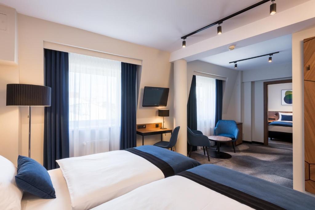 Posteľ alebo postele v izbe v ubytovaní Ascot Premium Hotel