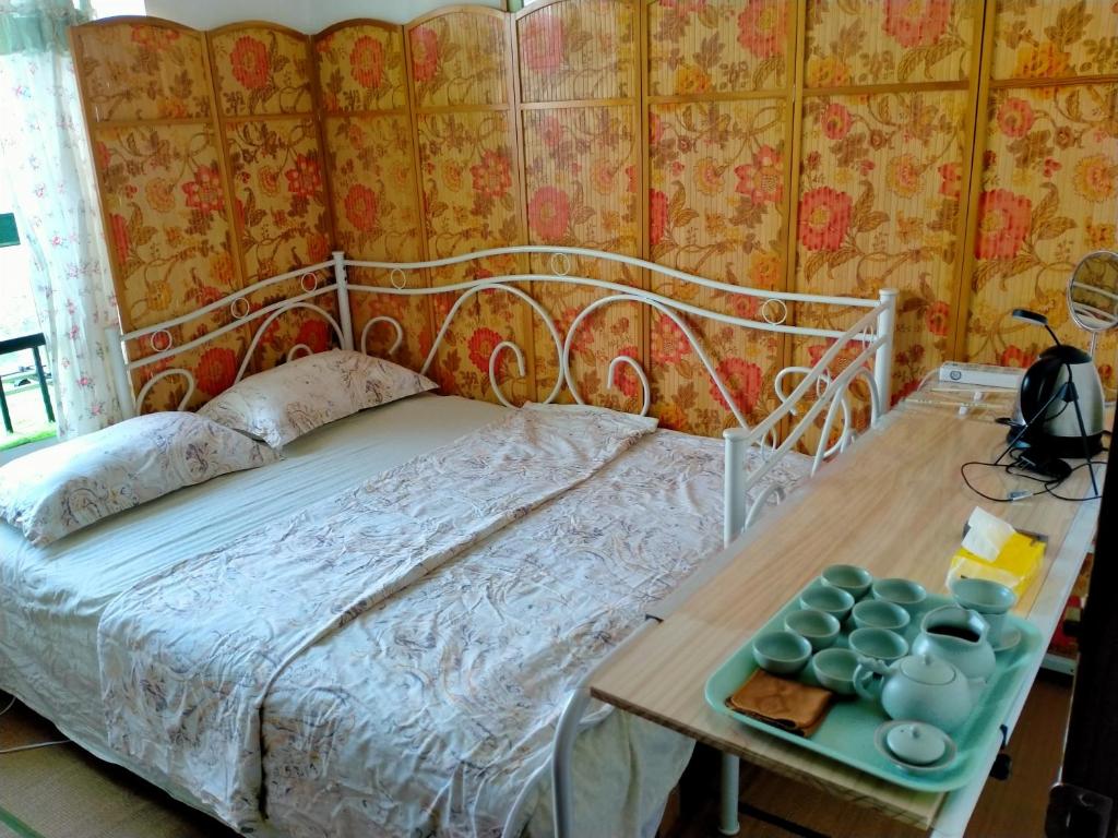 Postel nebo postele na pokoji v ubytování Yi Ju Homestay-ZhuanQiao Subway Station, MinHang District