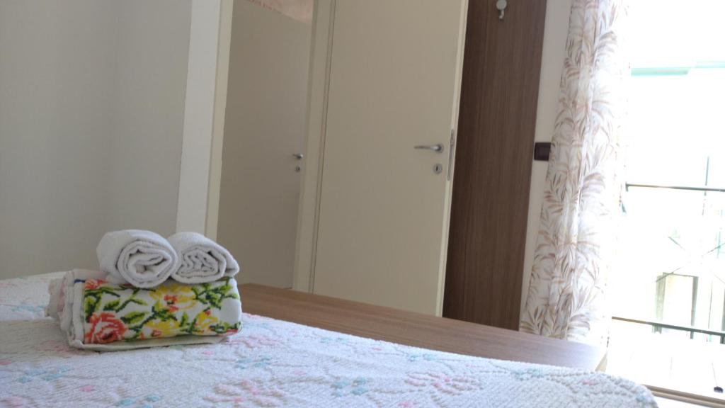 Postel nebo postele na pokoji v ubytování Delle Rose apartment
