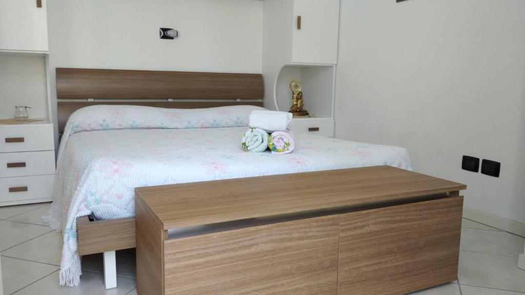 Postel nebo postele na pokoji v ubytování Delle Rose apartment