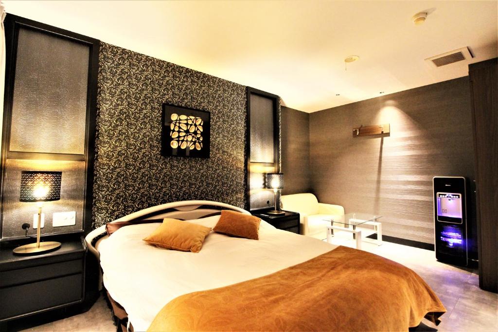 Postel nebo postele na pokoji v ubytování Hotel Riviera Sagamihara (Adult Only)