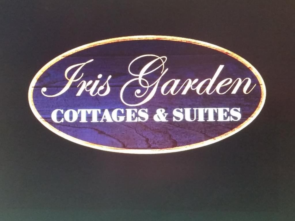 a sign for a garden societies and suites at The Iris Garden Downtown Cottages and Suites in Nashville