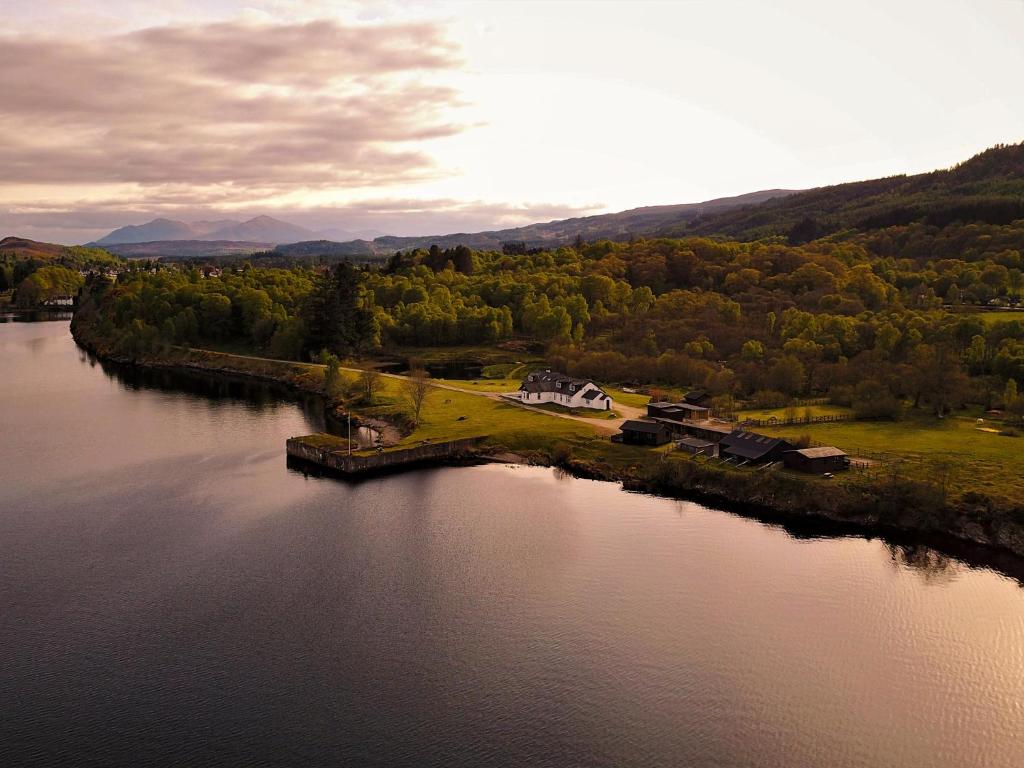 an island in the middle of a body of water at Cabins at Old Pier House in Fort Augustus