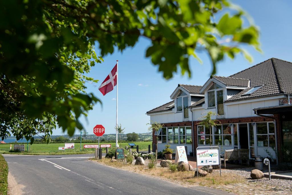 a canadian flag flying in front of a building at Samsted in Middelfart