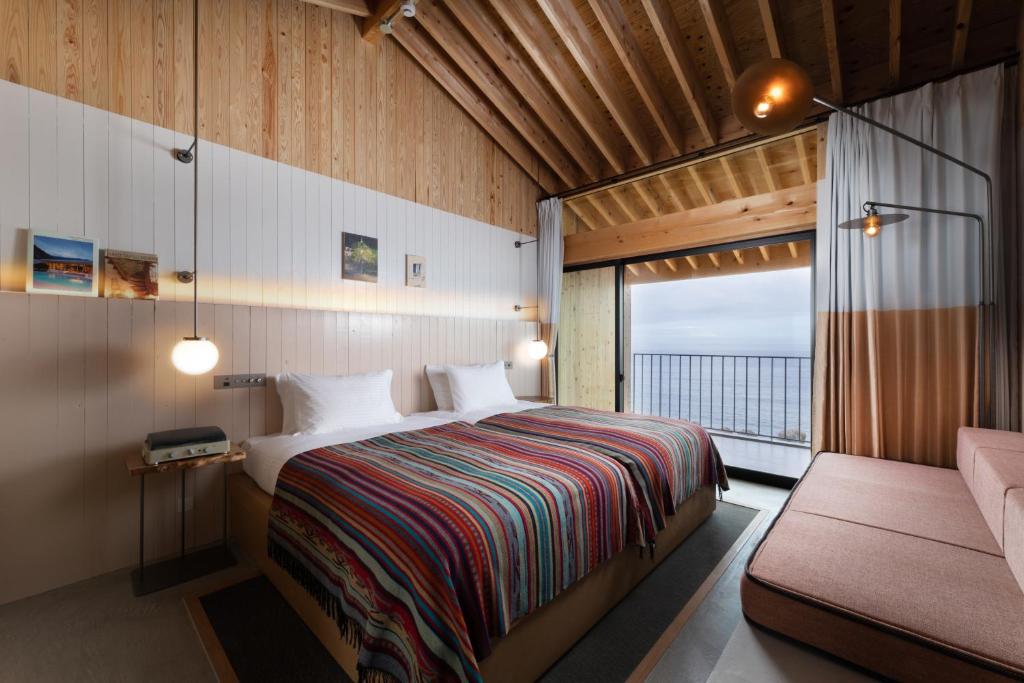 Postel nebo postele na pokoji v ubytování KAMOME SLOW HOTEL
