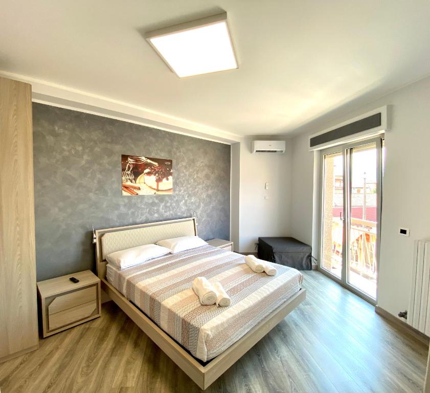 Postel nebo postele na pokoji v ubytování Siclari B&B-Rooms&Suite
