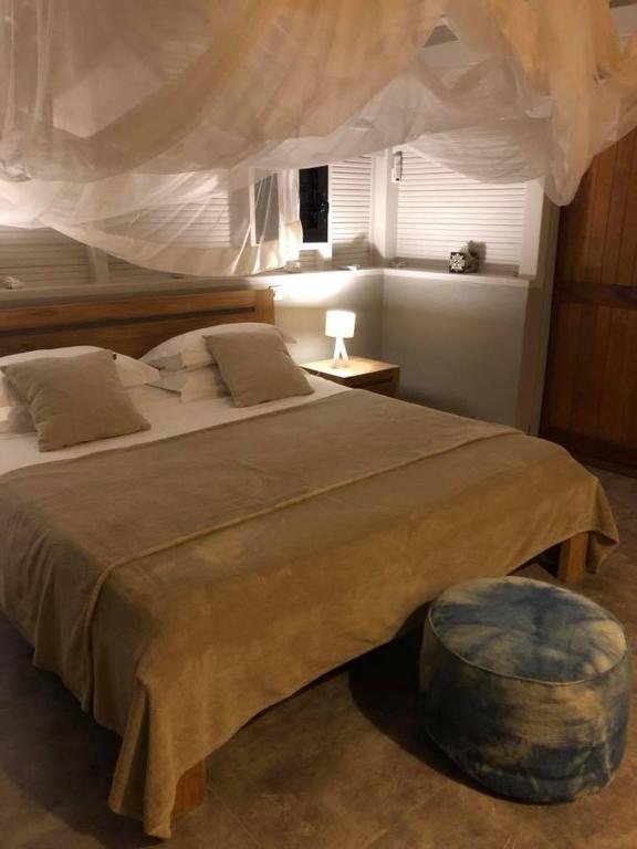 Postel nebo postele na pokoji v ubytování Shambala Lodge