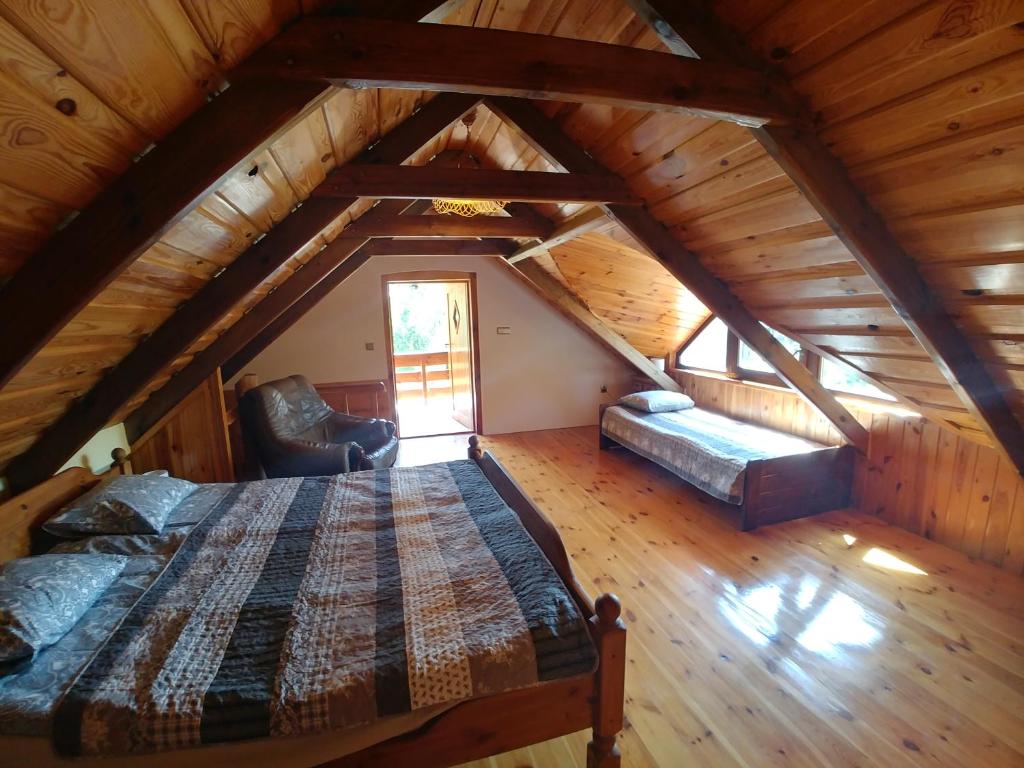Postel nebo postele na pokoji v ubytování Stary Spichlerz nad Wartą