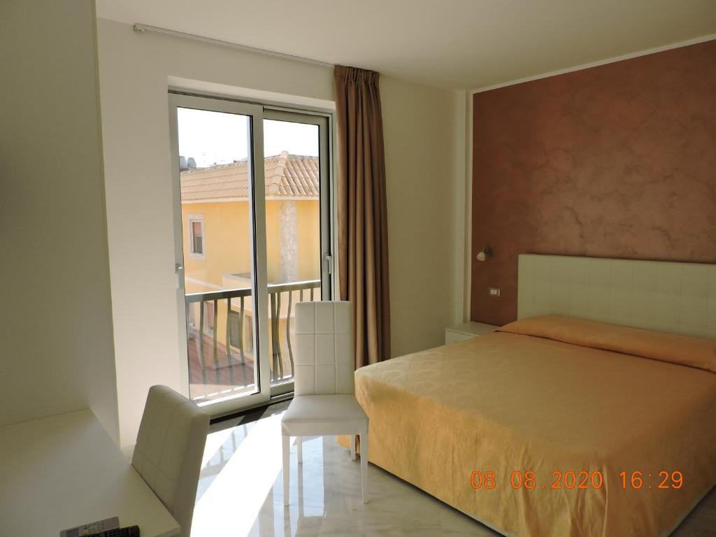 Postel nebo postele na pokoji v ubytování B&B Aquila Reale