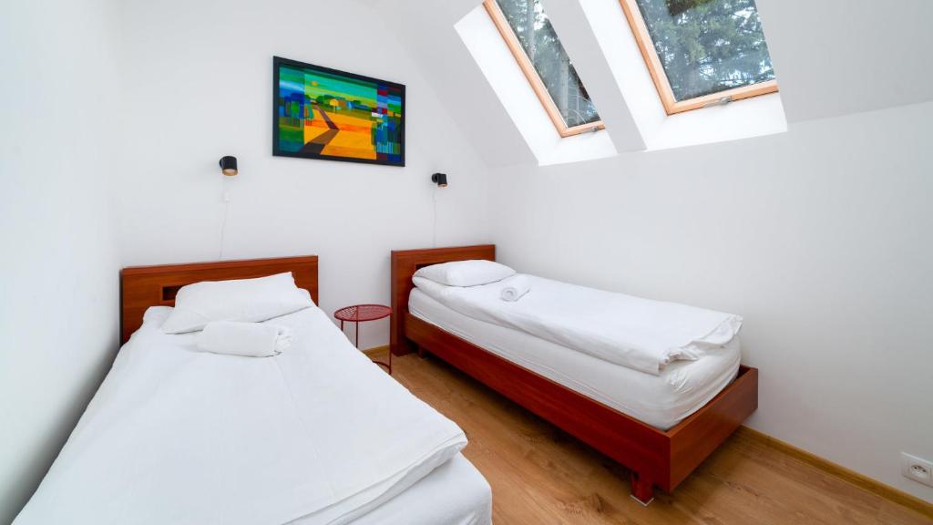 Posteľ alebo postele v izbe v ubytovaní Apartamenty EverySky - Wyspiańskiego 4