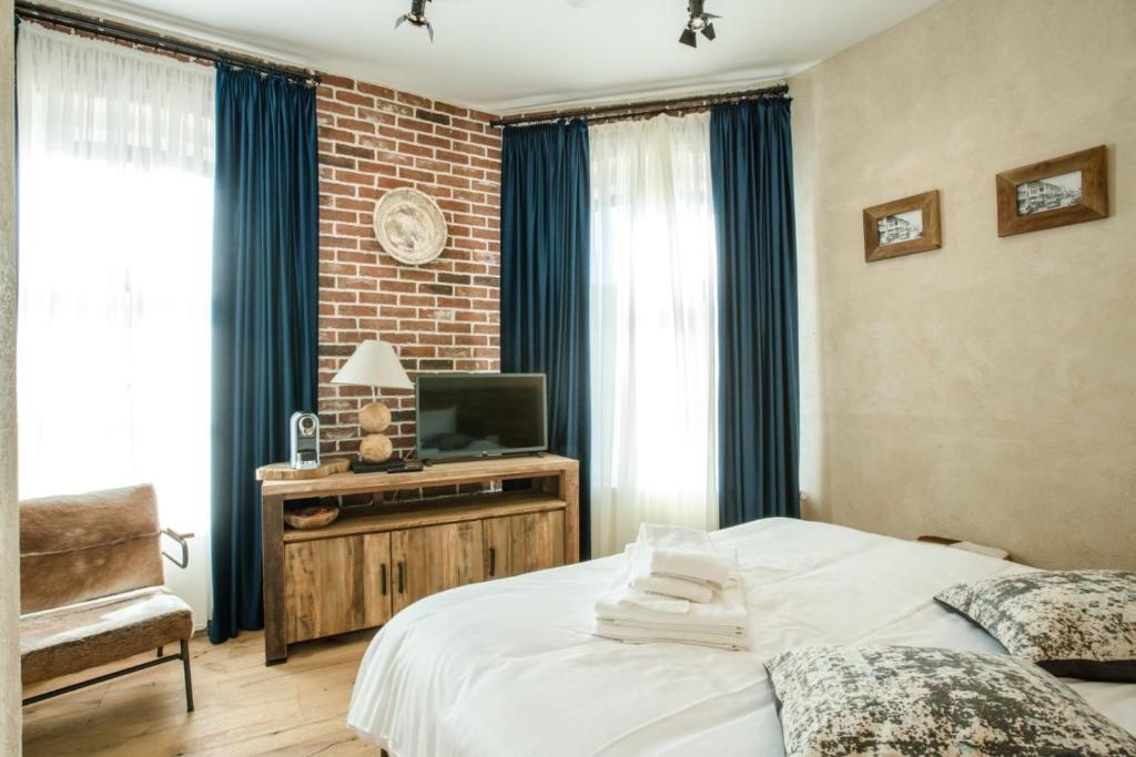 Postel nebo postele na pokoji v ubytování ACSA INN