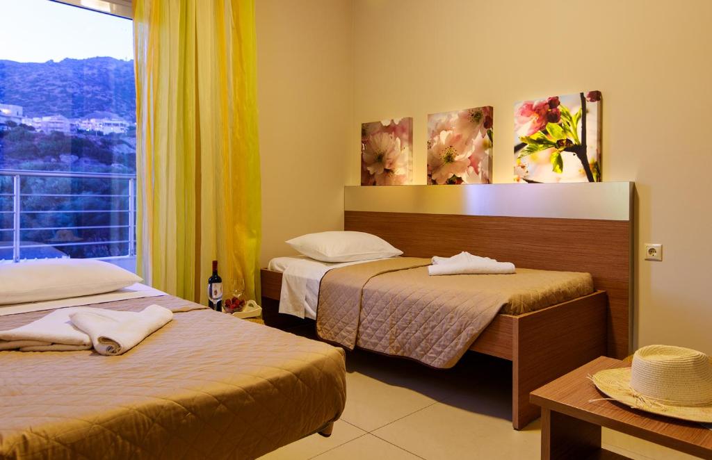 Posteľ alebo postele v izbe v ubytovaní Relax Hotel