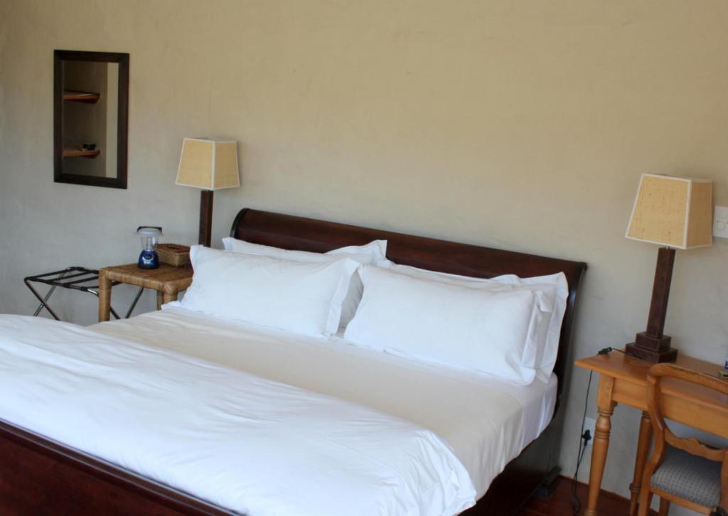 Postel nebo postele na pokoji v ubytování Sederkloof Lodge