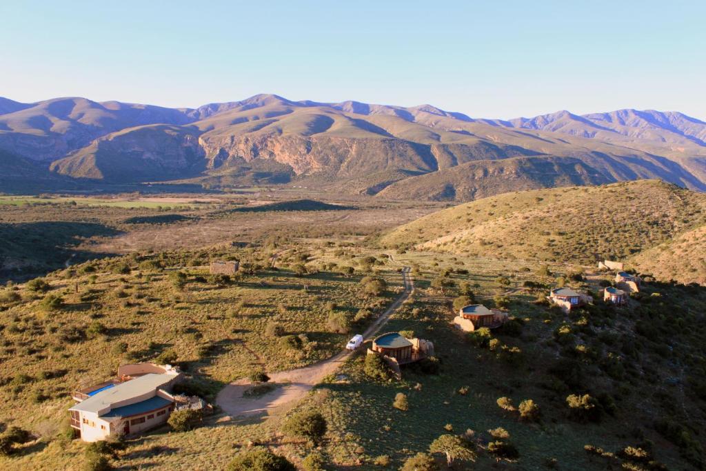 an aerial view of a desert with mountains in the background at Sederkloof Lodge in Studtis