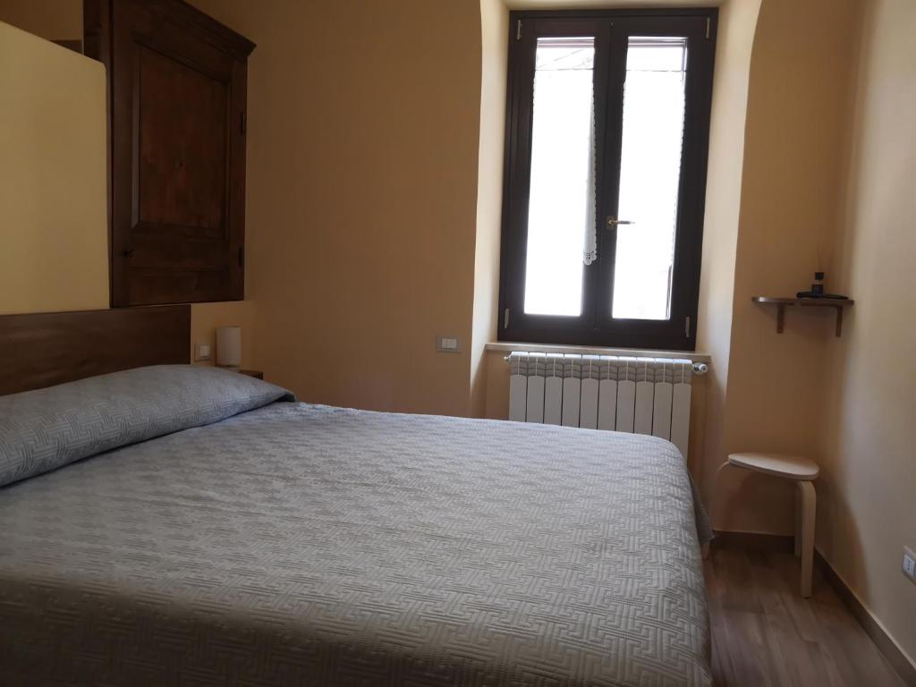 Postel nebo postele na pokoji v ubytování Alla Piazza Vecchia