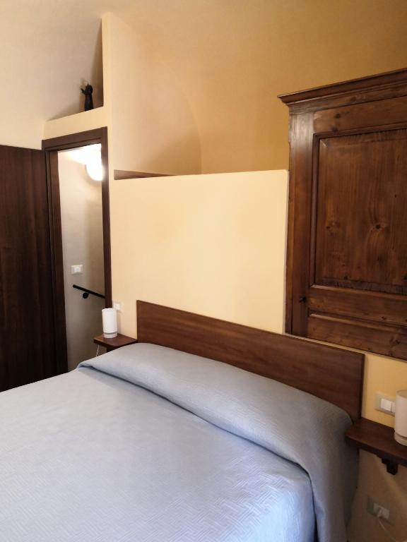 Postel nebo postele na pokoji v ubytování Alla Piazza Vecchia