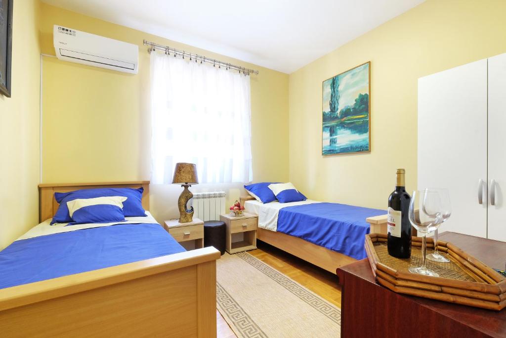 Postel nebo postele na pokoji v ubytování Villa Tower Gardos