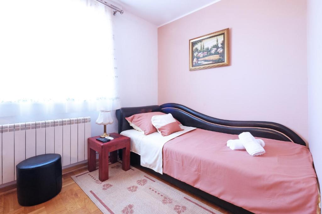 Postel nebo postele na pokoji v ubytování Villa Tower Gardos