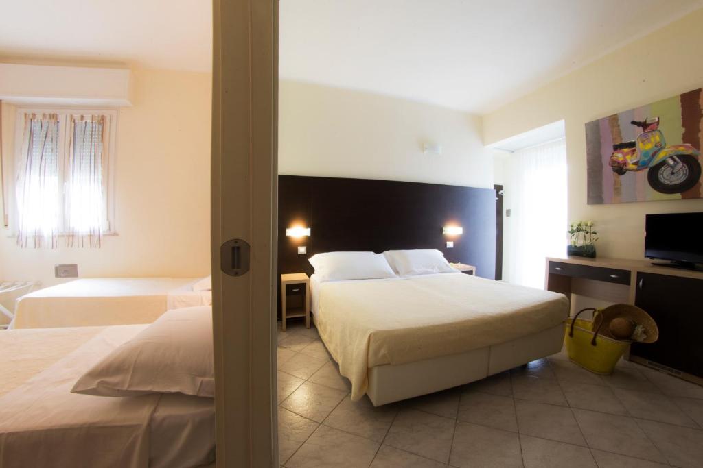 Postel nebo postele na pokoji v ubytování Hotel Sole
