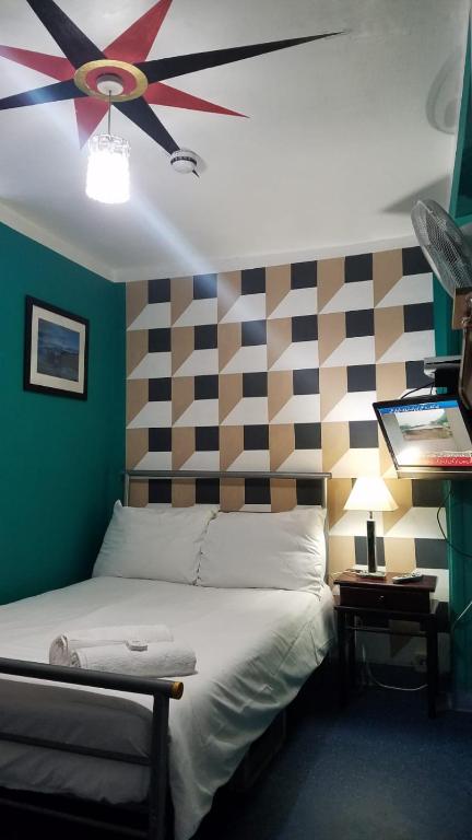 Postel nebo postele na pokoji v ubytování City View Hotel Roman Road