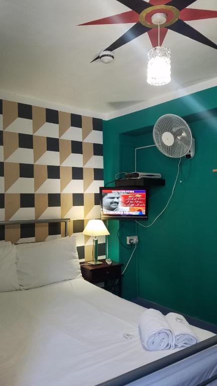Postel nebo postele na pokoji v ubytování City View Hotel Roman Road