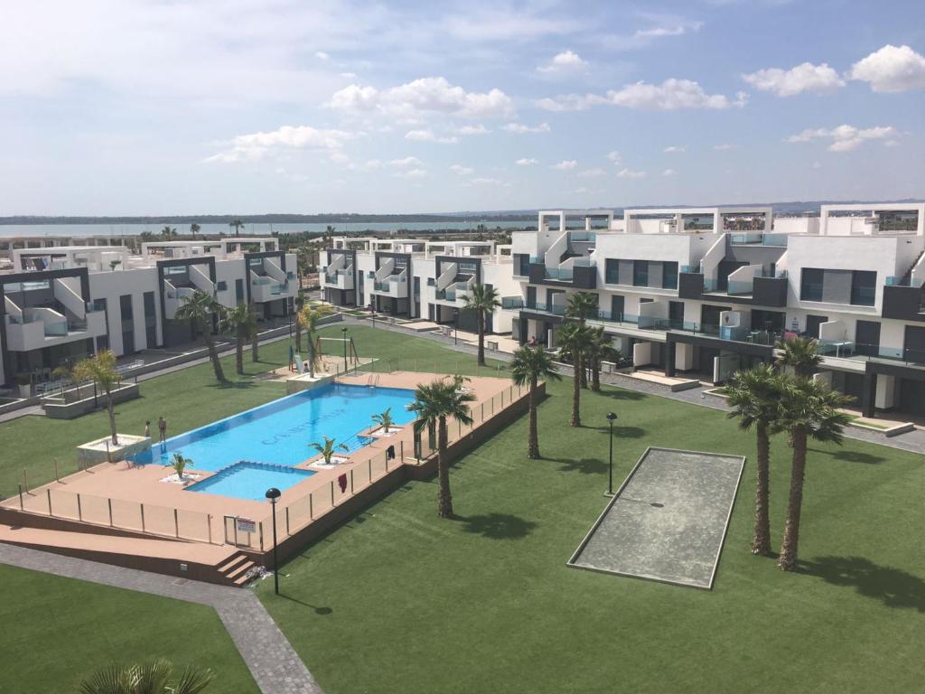 an aerial view of an apartment complex with a swimming pool at Oasis Beach Dream Holiday in Guardamar del Segura
