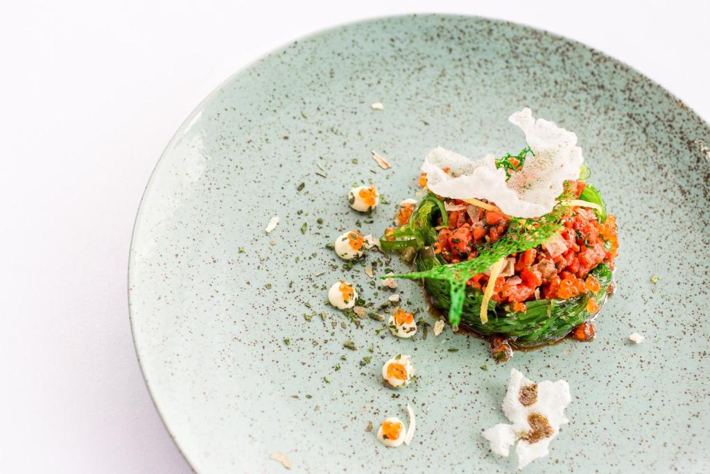a plate of food with a salad on it at Hotel Thermal in Karlovy Vary