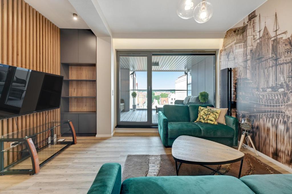 Televízia a/alebo spoločenská miestnosť v ubytovaní Granaria Comfort Apartments