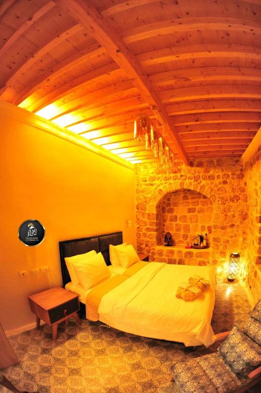 Postel nebo postele na pokoji v ubytování Salah Aldin House