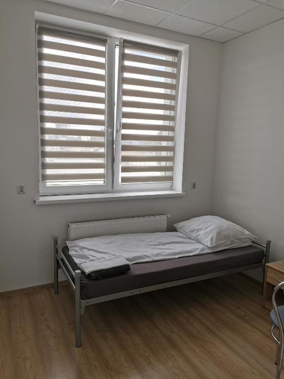Postel nebo postele na pokoji v ubytování Wielobranżówka