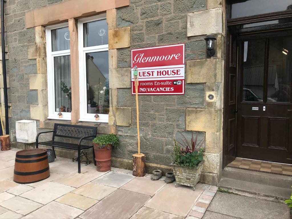 a sign on the side of a building at Glenmoore Guest House in Oban