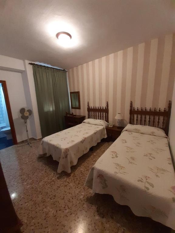 Postel nebo postele na pokoji v ubytování Hotel Andalucía