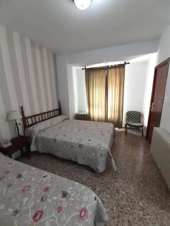 Postel nebo postele na pokoji v ubytování Hotel Andalucía