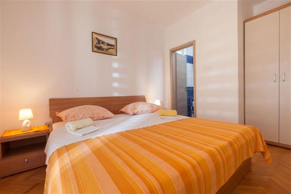 Postel nebo postele na pokoji v ubytování Apartments Marino Gojak