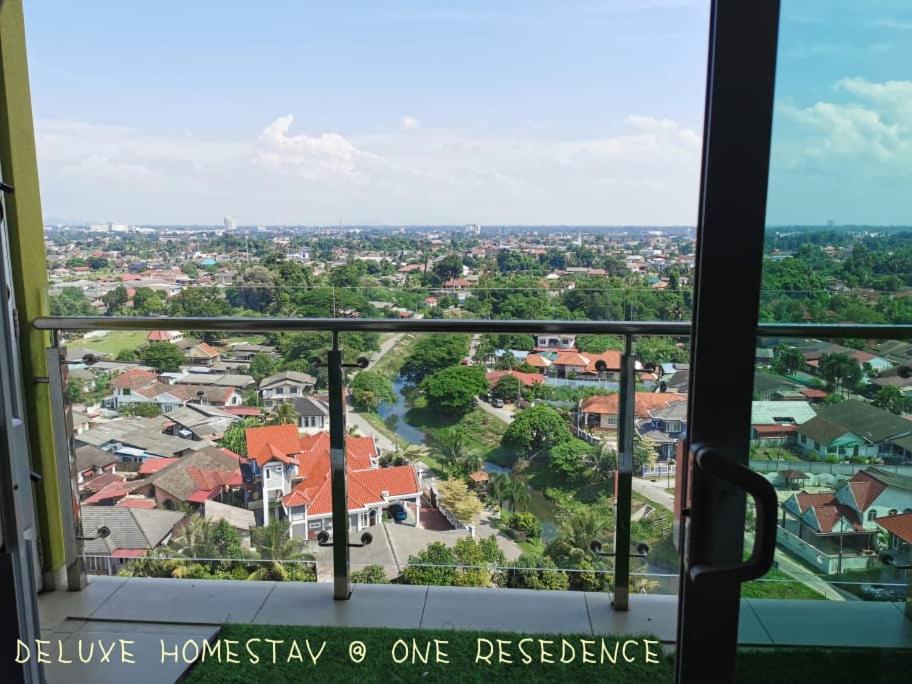 a view of a city from a window at DELUXE HOMESTAY @ ONE RESIDENCE in Kota Bharu