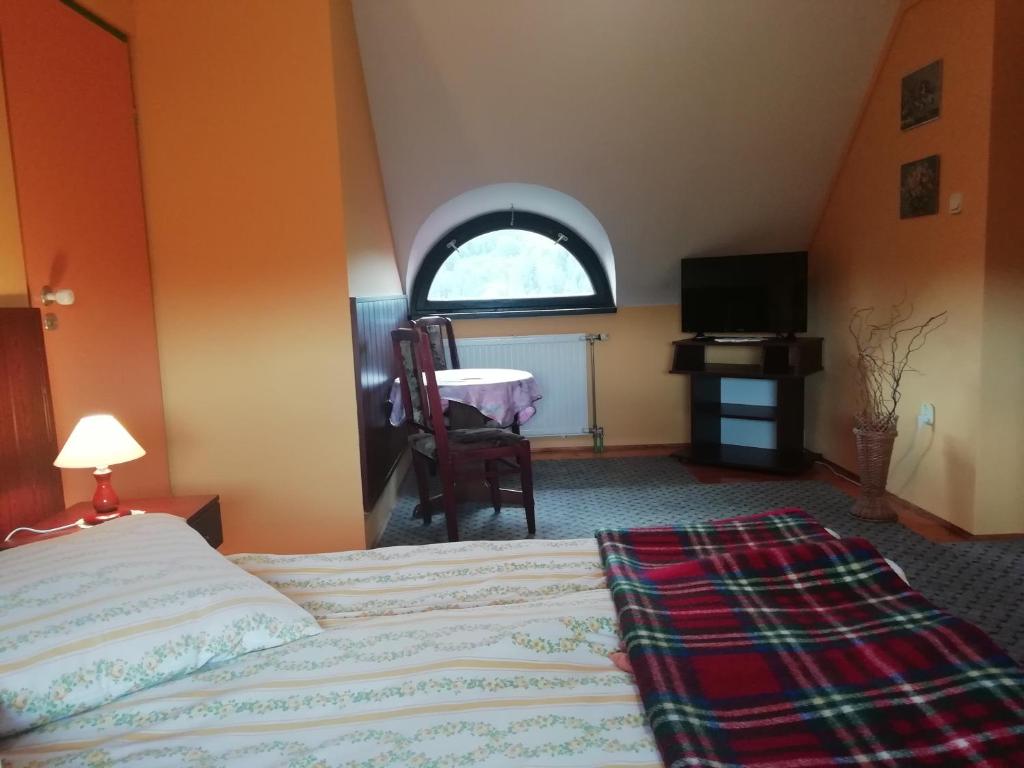 Postel nebo postele na pokoji v ubytování Dworek Sylwia