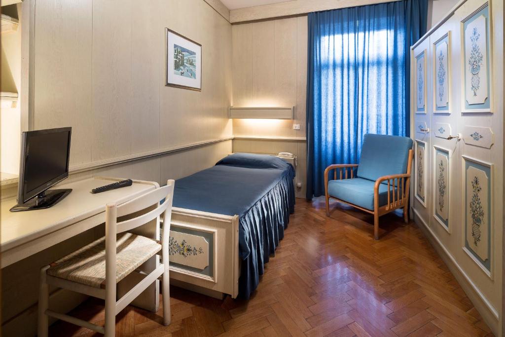 Postel nebo postele na pokoji v ubytování Hotel Corona