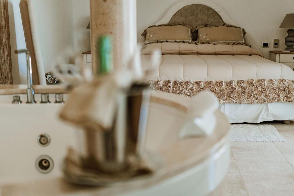 Postel nebo postele na pokoji v ubytování Hotel Pulicinu