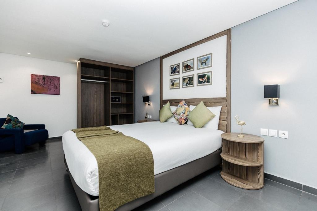 Voodi või voodid majutusasutuse Wazo Appart-Hôtel toas