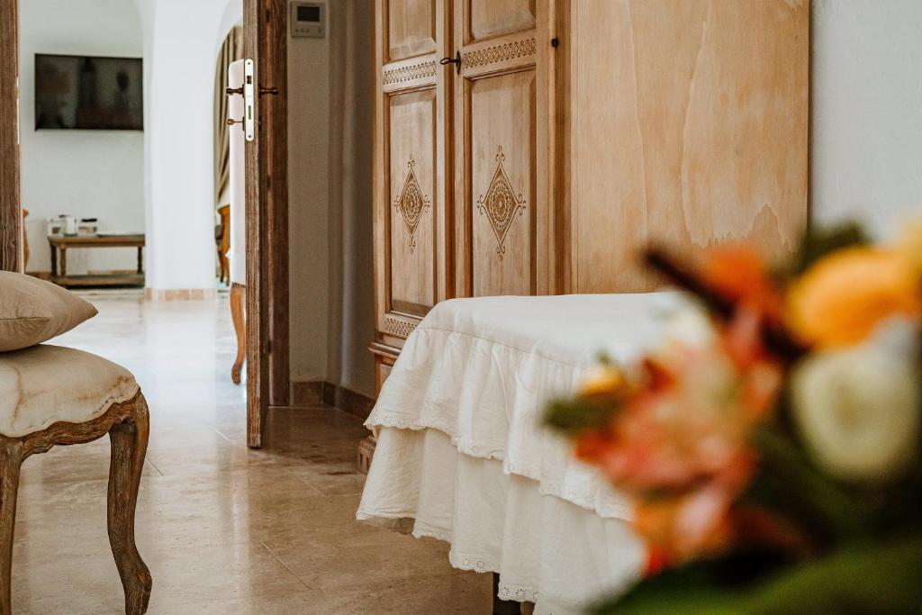 Postel nebo postele na pokoji v ubytování Hotel Pulicinu