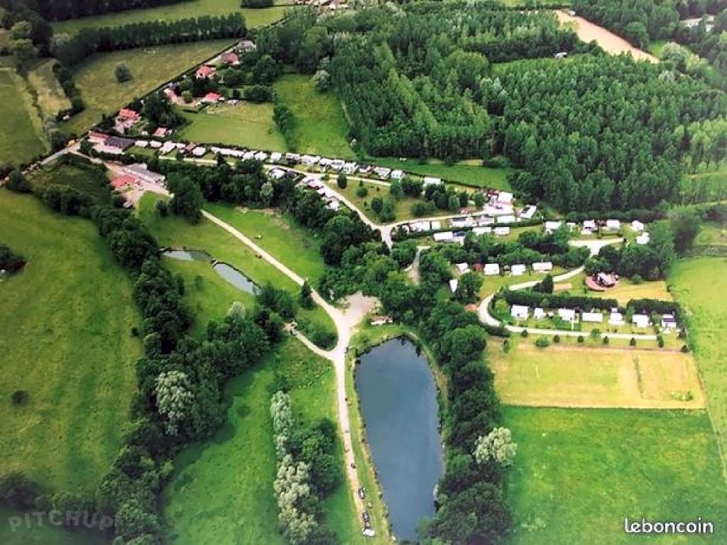 an aerial view of a park with a bridge at Camping la Nouvelle Aventure in Audincthum