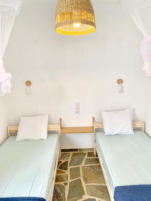 Postel nebo postele na pokoji v ubytování Kalimera homes