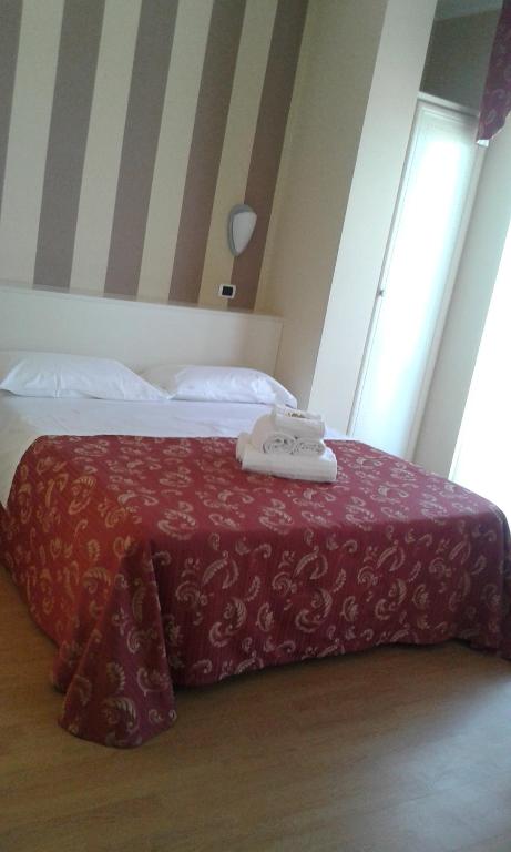 Łóżko lub łóżka w pokoju w obiekcie Hotel La Palazzina