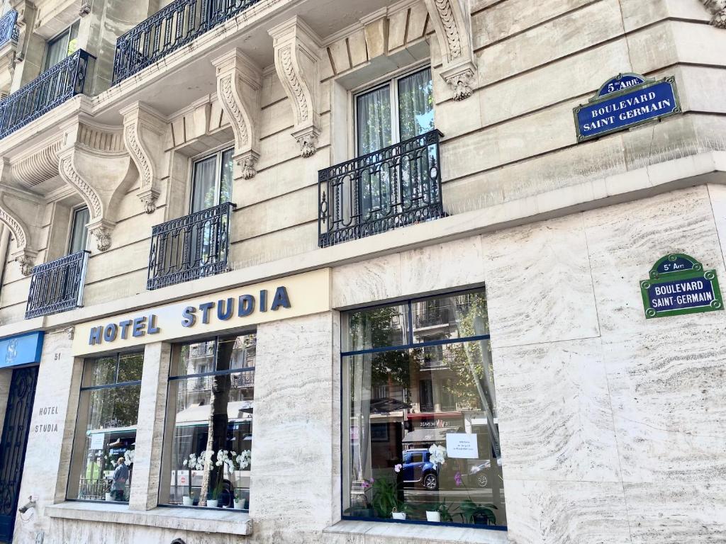 a facade of a building with a hotel studio at Hotel Studia in Paris