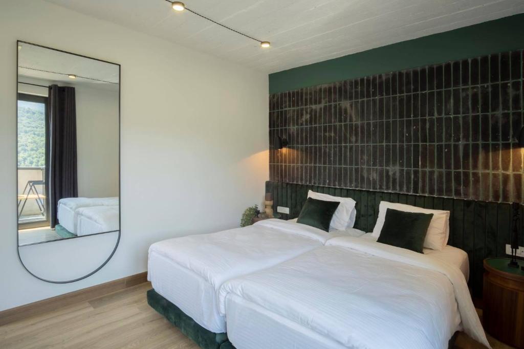 Postel nebo postele na pokoji v ubytování Hover Boutique Hotel