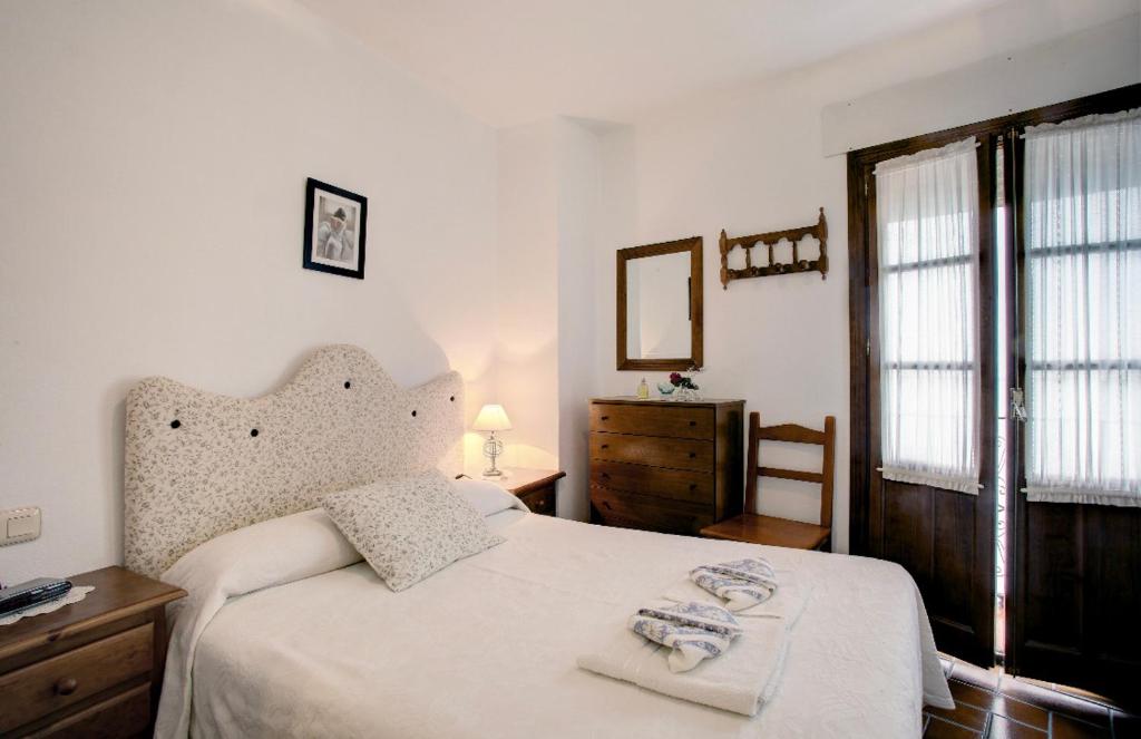 Een bed of bedden in een kamer bij La Casita
