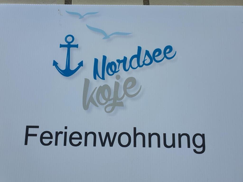 an image of a sign with an anchor and the words i norwegiankle at Nordsee-Koje in Brunsbüttel