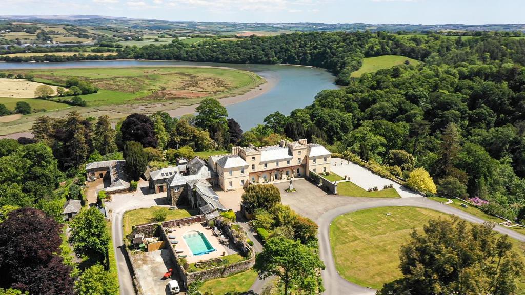 an aerial view of a mansion with a river at Pentillie Castle and Estate in Saltash