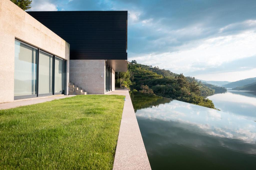 a house with a view of the water at Feel Discovery Douro Cherry in Resende